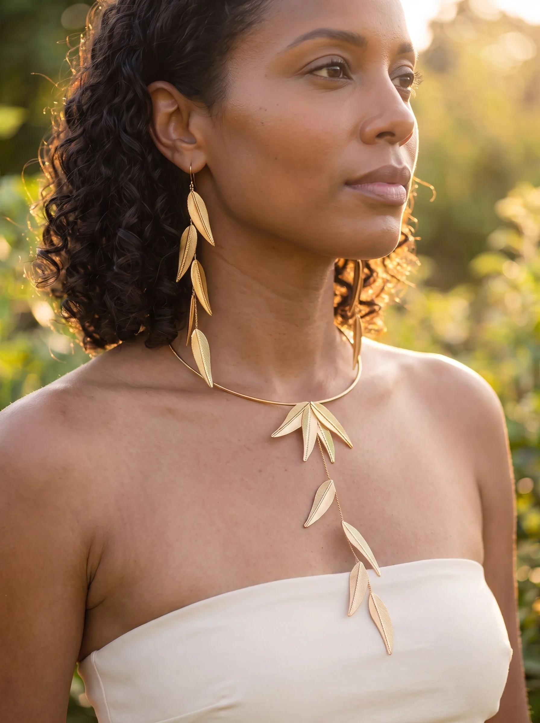A woman with dark natural coils wearing the Willow Set, close up